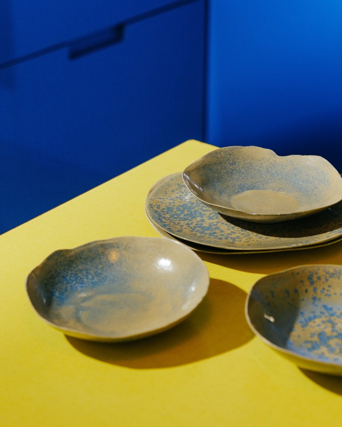 A series of ceramic plates made by his mother