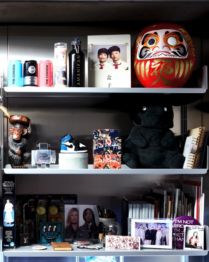 Shelves in the designer’s office with items from some of his collections