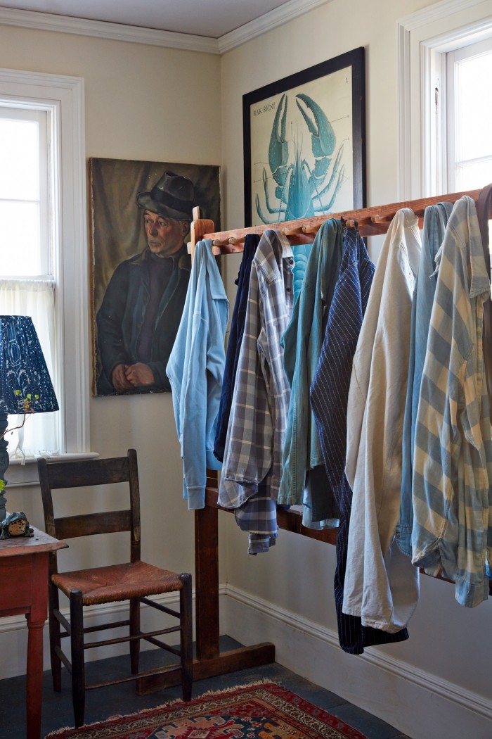 An antique rack of clothes including Derian’s striped trousers by Double RL