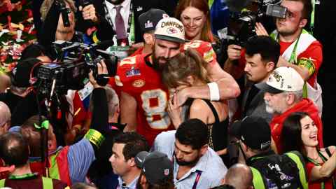 Taylor Swift and Kansas City Chiefs’ Travis Kelce embrace after the Chiefs won the Super Bowl