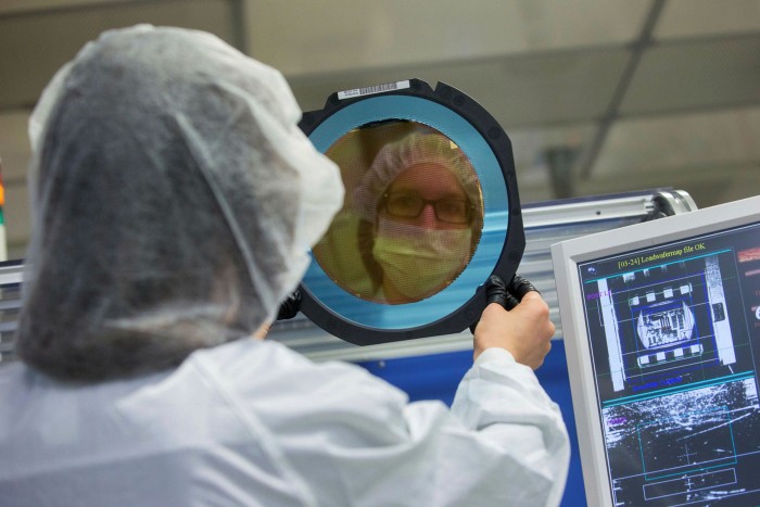 A wafer undergoes inspection at a manufacturing facility in Germany