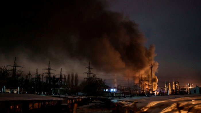 Smoke billows from power infrastructure following a Russian drone attack in Kyiv region, Ukraine