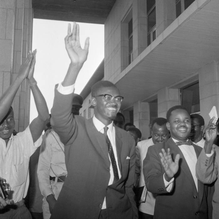 Patrice Lumumba, the first prime minister of the Democratic Republic of Congo, waves at supporters