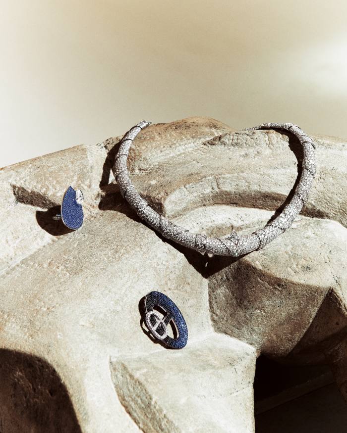 Clockwise from left: Hermès white-gold, diamond and midnight-blue sapphire Miroir d’Ombre ring. Louis Vuitton white-gold and diamond monogram-star-cut Grace necklace. Hermès white-gold, diamond, black spinel and blue sapphire Chaînes d’Ombre brooch
