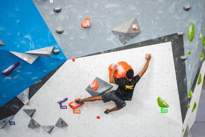 Soulsenders Climbing Team member Aden, 16, climbing in a competition at Memphis Rox