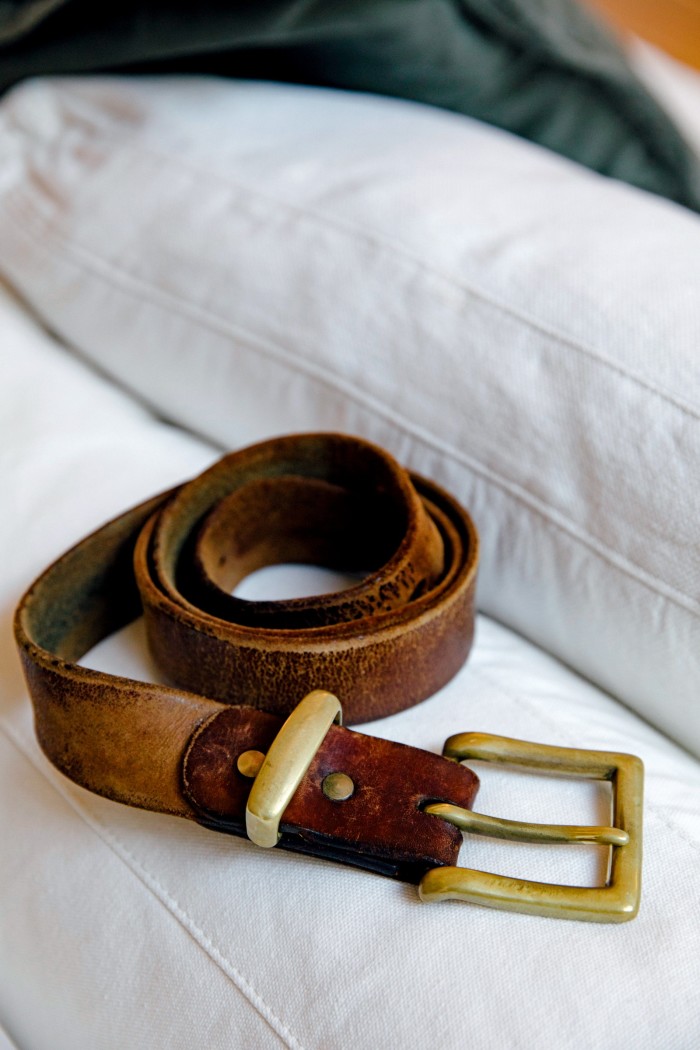 His style signifier, a leather belt bought in San Francisco’s Mission District