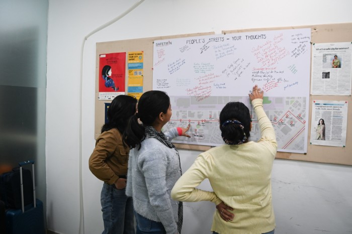 Women look at a map in the Safetipin office