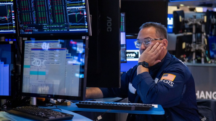 A trader works on the floor of the New York Stock Exchange (NYSE) in New York