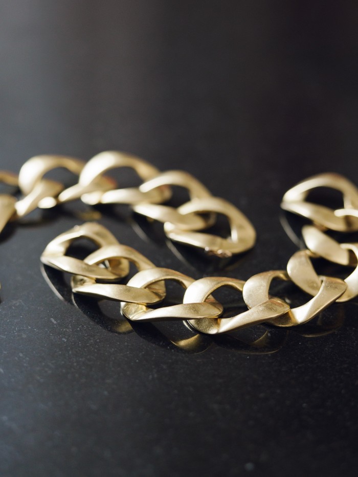 Bromberg Hawkings’ gold chain link bangles, a gift from Tom Ford