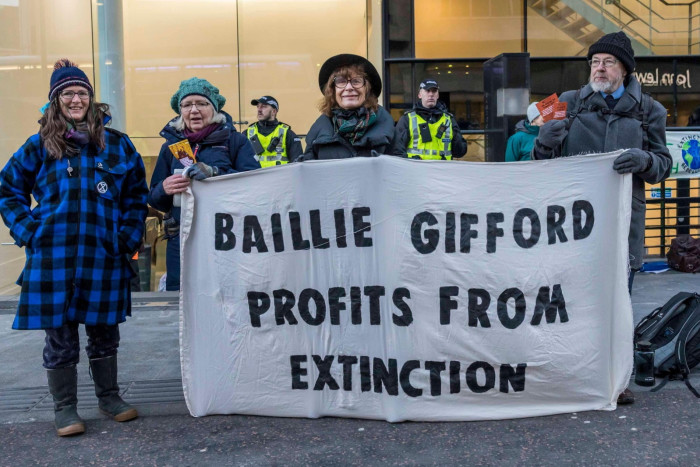 Protesters from Extinction Rebellion block the entrance to Baillie Gifford