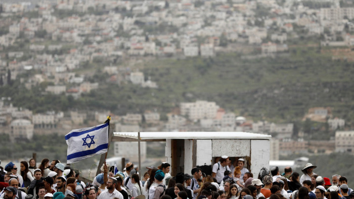 Israeli settlers march to the Evyatar outpost
