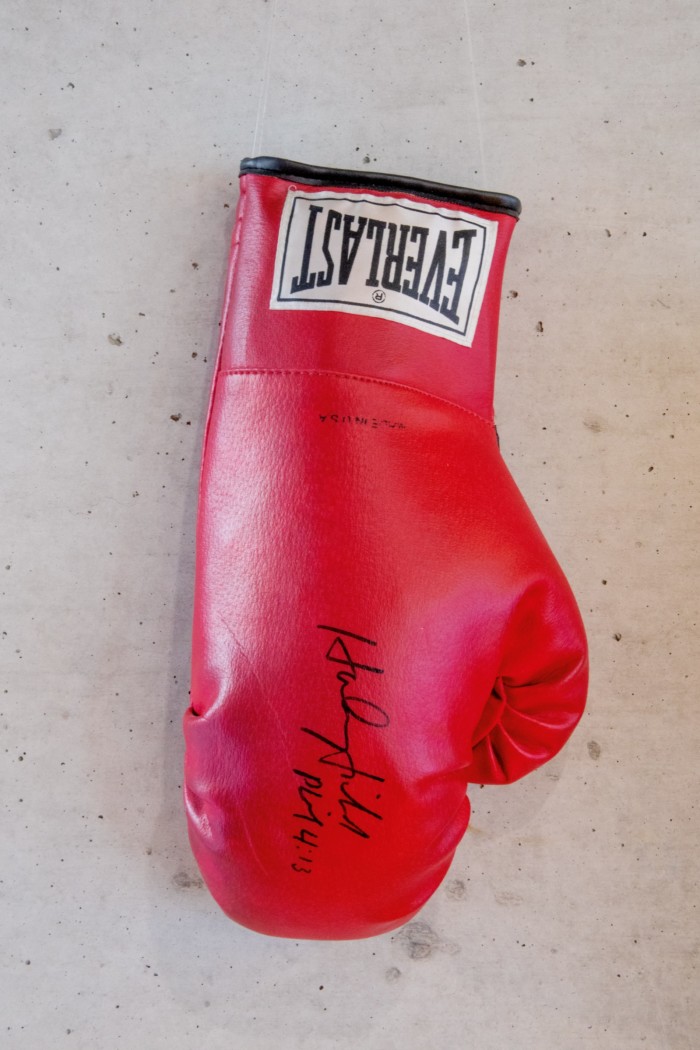 A boxing glove signed by heavyweight champion Evander Holyfield and gifted to Ando