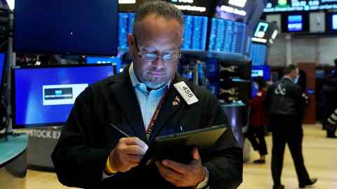 Trader Robert Arciero works on the floor of the New York Stock Exchange, Tuesday, August 10, 2021