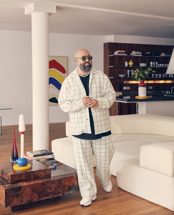 Casablanca founder Charaf Taje at home in London. Behind him is Expo, 2016, by Henrietta Dubrey