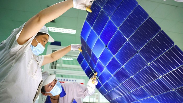 Solar panels being manufactured for export at a Chinese factory
