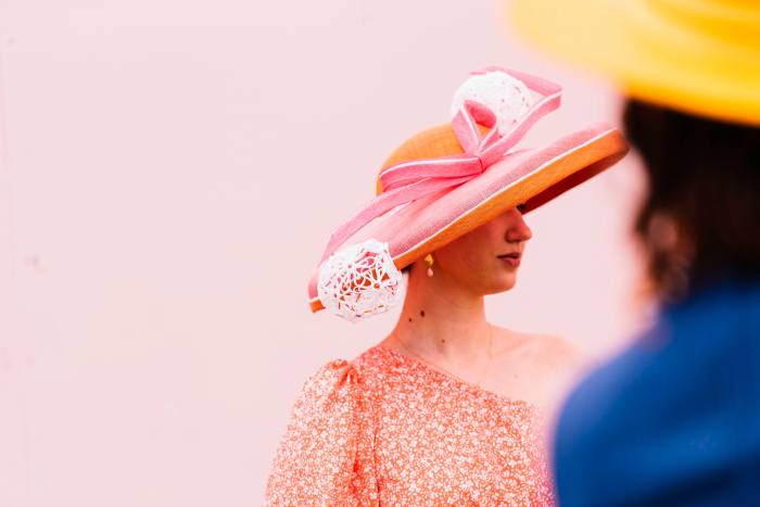 Two women in large stylish hats at the 2022 Melbourne Cup Day