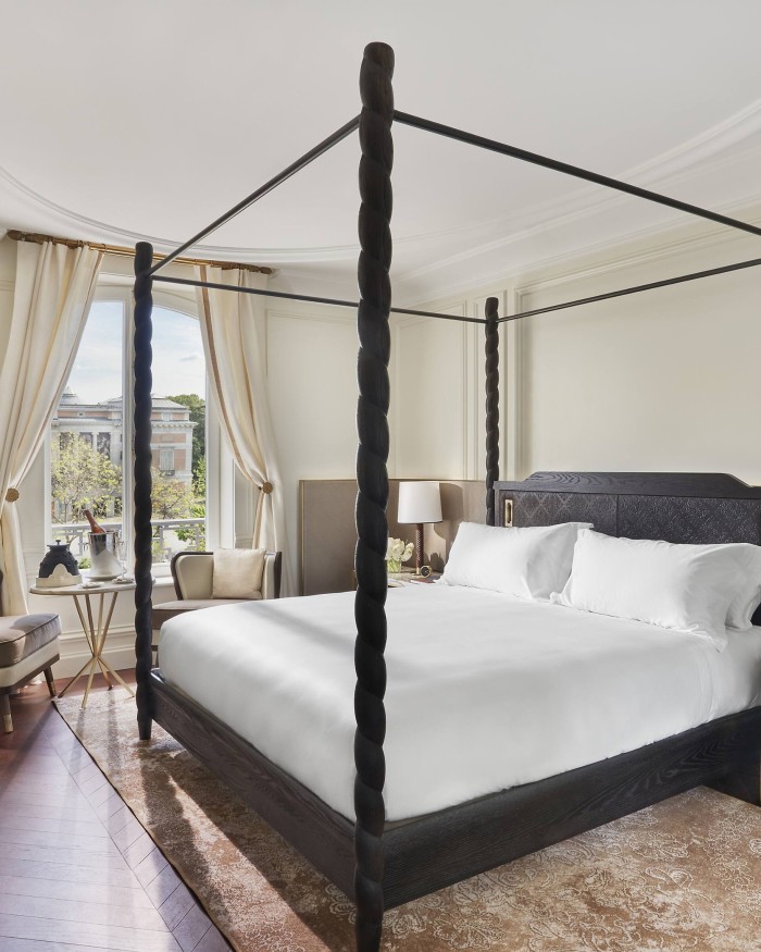 A four-poster bed in a deluxe room at the Mandarin Oriental Ritz