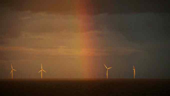 A rainbow and wind turbines in the North Sea of the coast of Essex