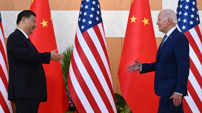 US President Joe Biden (R) and China’s President Xi Jinping (L) shake hands as they meet on the sidelines of the G20 Summit in Nusa Dua on the Indonesian resort island of Bali on November 14, 2022