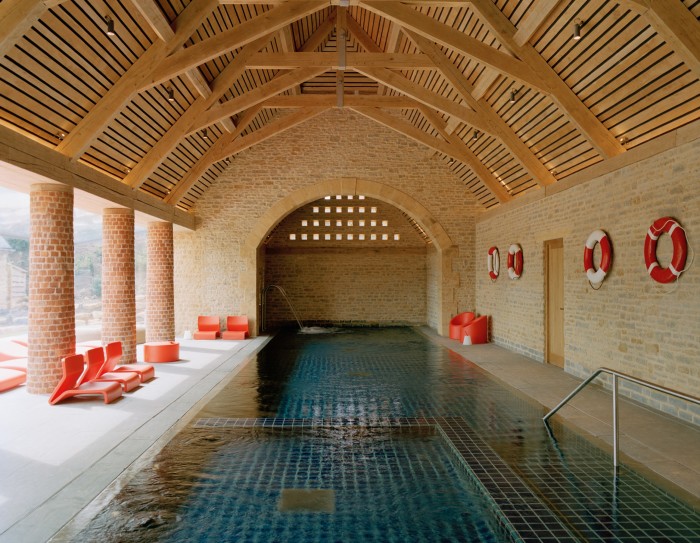 The pool is housed in a former barn, with roof beams crafted by local artisans
