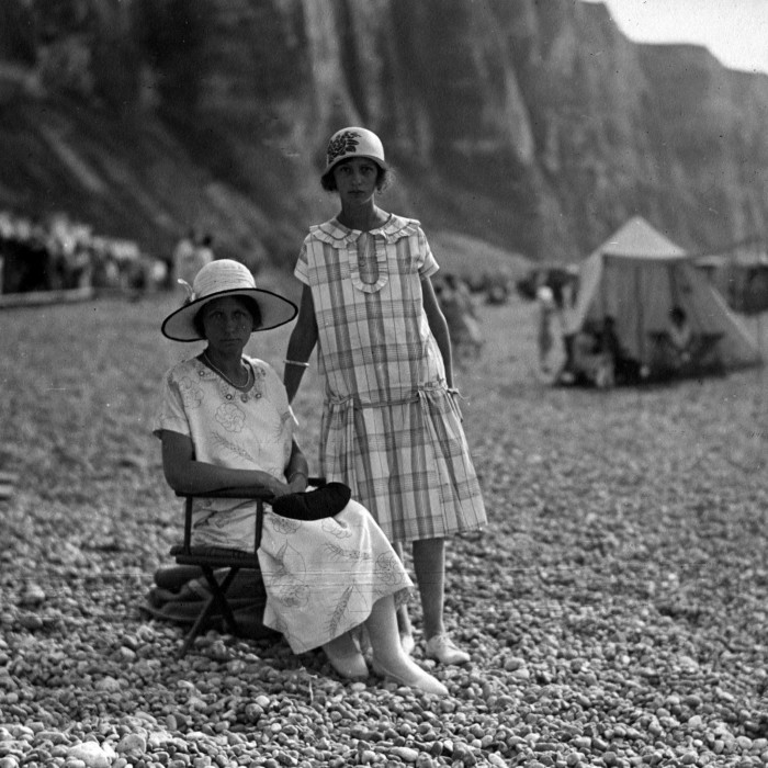 Étretat has long been a favourite of fashionable French society, from this Parisian mother and daughter seen here in 1920 . . .