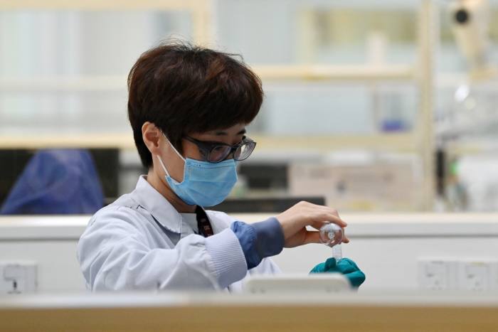 A staff member works at a lab of Novo Nordisk