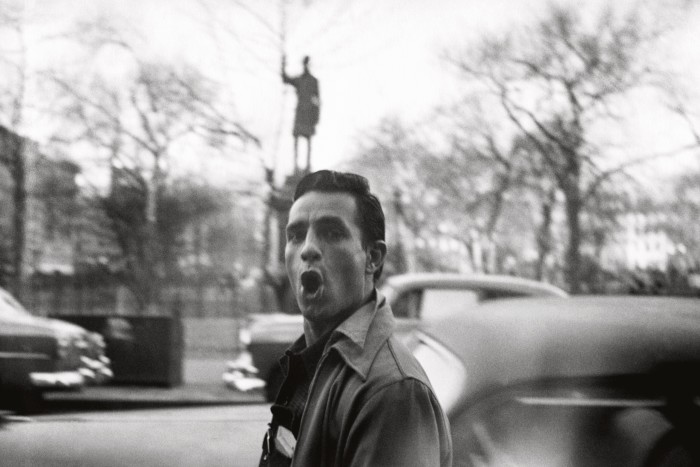 Jack Kerouac passes a statue of Samuel Cox in Tompkins Square, New York, 1953