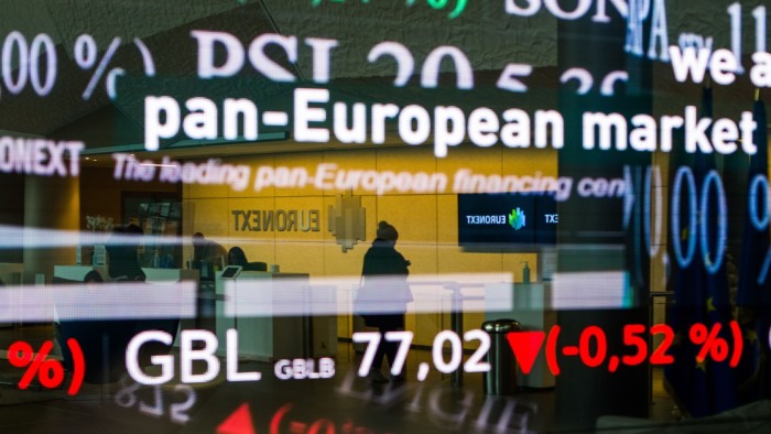 Stock price information displayed in the entrance hall of the Euronext NV stock exchange in Paris, France