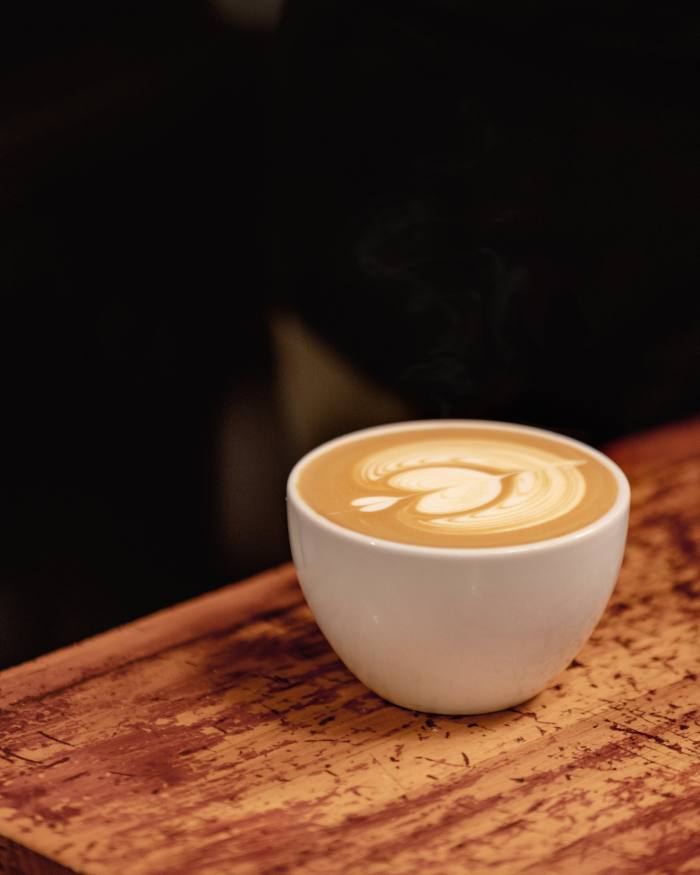A latte on a counter at Manchester Press