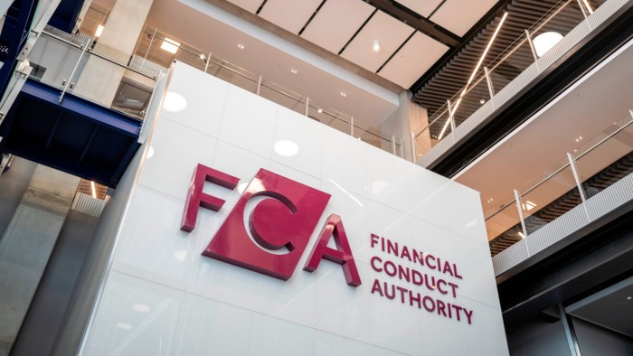 An embossed logo and name of the Financial Conduct Authority on a wall