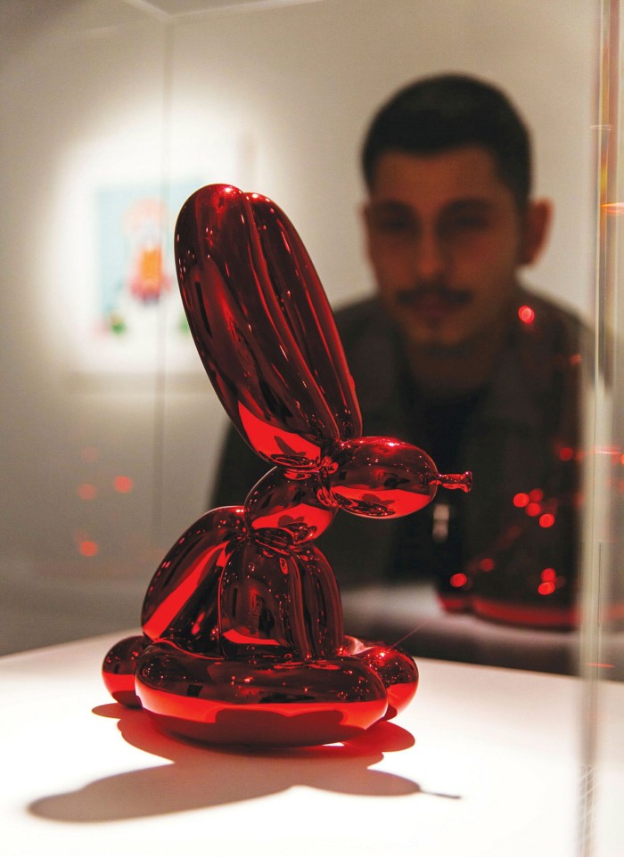 A red porcelain sculpture of Jeff Koons’ ‘Balloon Rabbit’