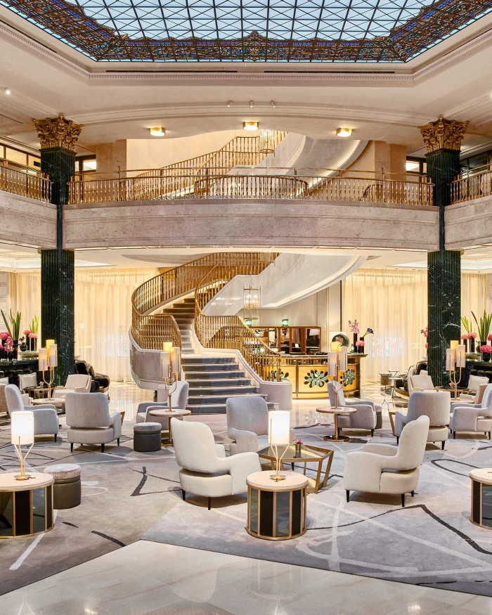 The hotel’s lavish marble lobby, with a stairwell spiralling up the middle of it