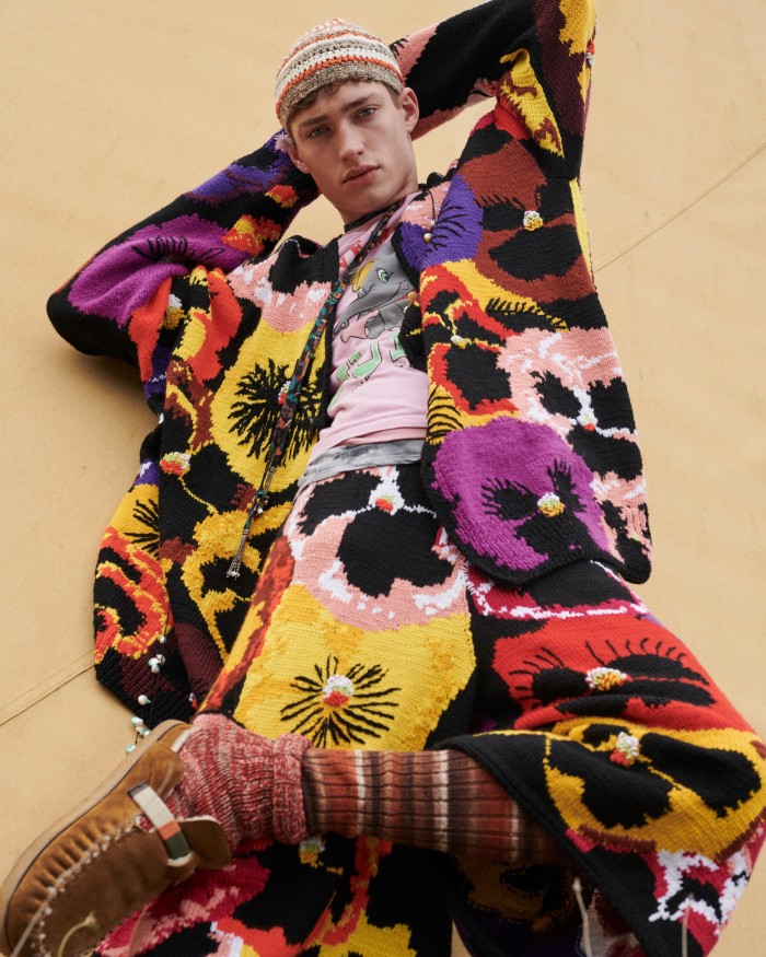 Valentin wears Loewe wool cardigan, £2,100, and wool shorts, £1,750. T-shirts, model’s own. Nick Fouquet – Federico Curradi suede and shearling shoes, £623. Umit Benan cotton hat, £170. Etro silk foulard choker, £420. Panconesi enamel and natural-pearl necklaces (worn as brooches), €325 each. Falke cotton Brooklyn socks, £20, and long socks, model’s own