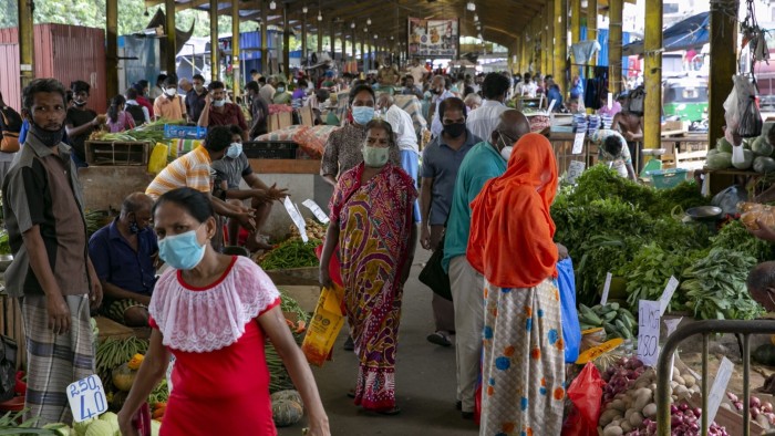 Shoppers in a market in Colombo