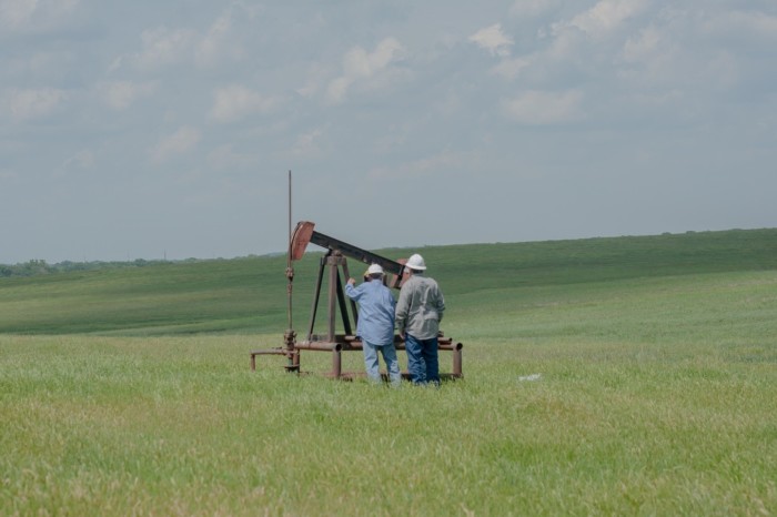 Rebellion Energy Solutions LLC workers check an orphaned oil well near Tulsa, Oklahoma