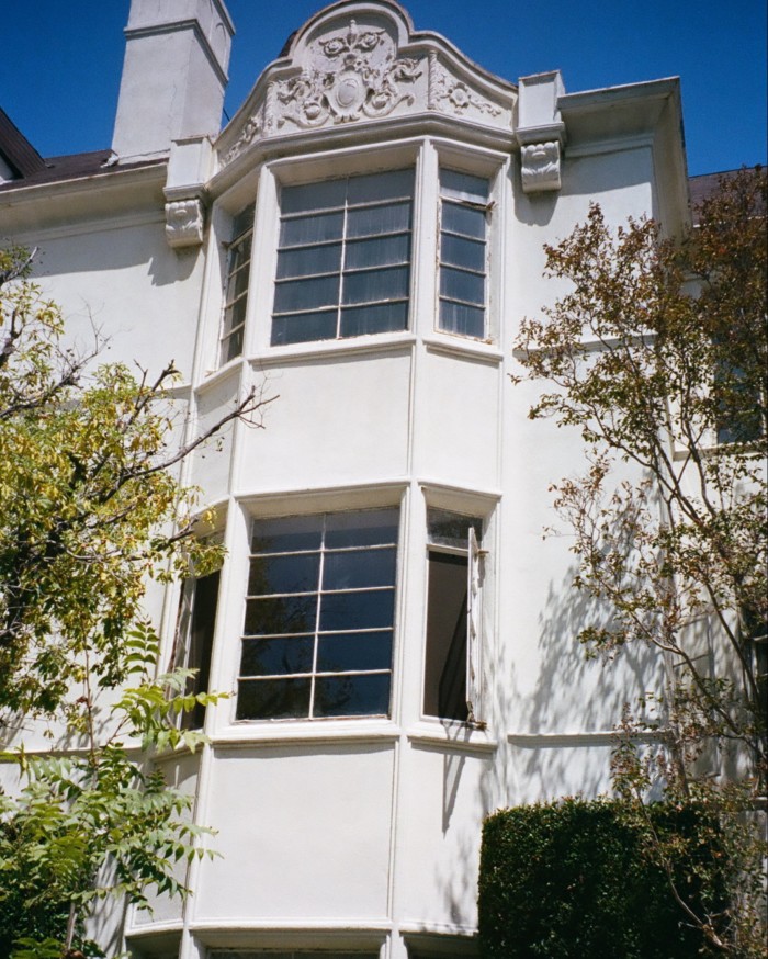 White bay windows on two storeys