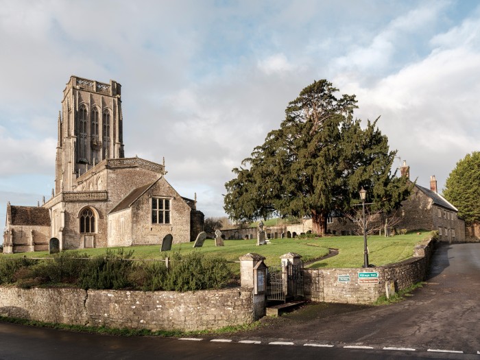 Batcombe church, with the pub to its right