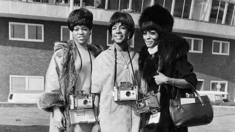Pop group The Supremes demonstrate Polaroid cameras in 1965