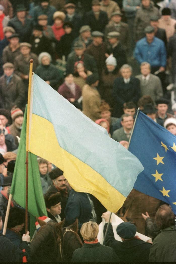Demonstrators wave Ukrainian and EU flags in the lead-up to Ukraine’s 1991 independence referendum . . . 