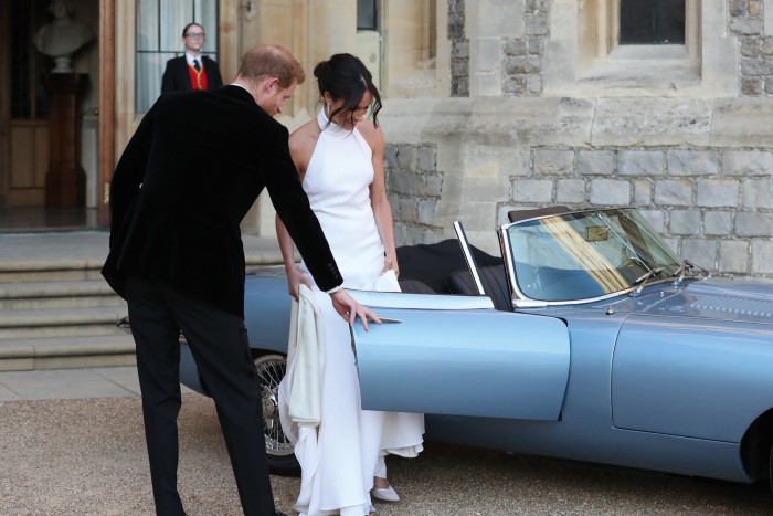 The Duke and Duchess of Sussex leave Windsor Castle in an electric Jaguar E-type after their wedding