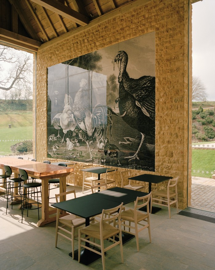 The Kitchen at the Farmyard, which offers all-day dining. The feature wall tiles are created from a 17th-century lithograph called “Turkeys & Fowls”