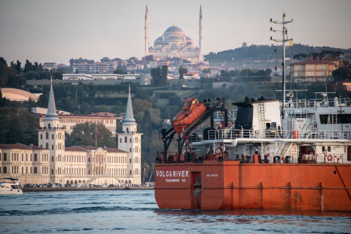 A Russia-flagged oil tanker passes through the Bosphorus Strait near Istanbul. An EU and UK price cap plan aims to ensure that Russian oil is bought at a price set in western capitals  