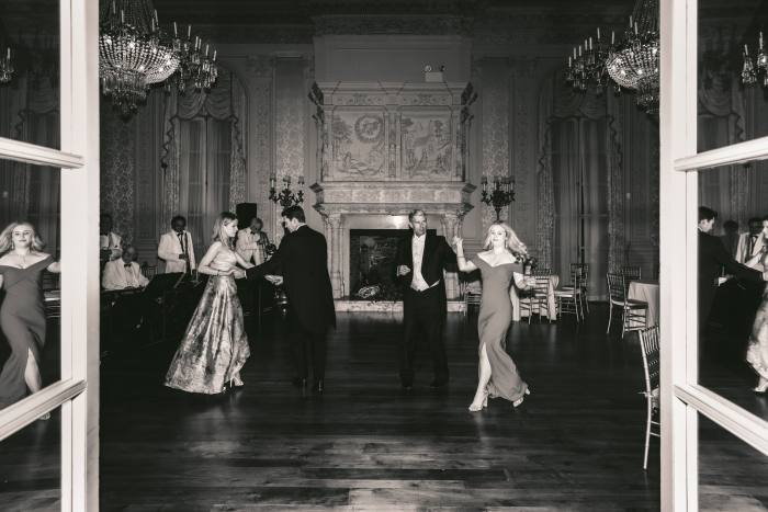 White-tie guests dance at Rosecliff
