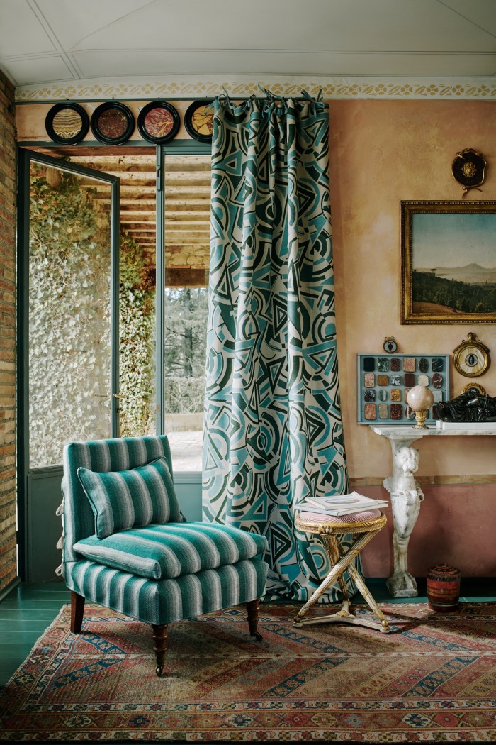 Forquet’s home in Cetona, Tuscany. The chair is upholstered in Shadow Line in June. The curtains are Trepak Weave in Sì!!