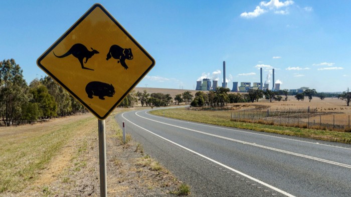 A road sign warning motorists of kangaroos, koalas and wombats stands by a highway leading to AGL’s coal-fired Loy Yang power station