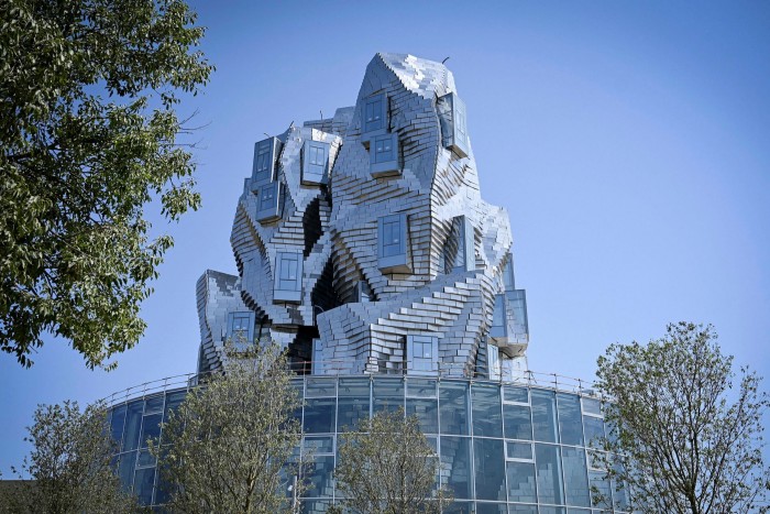 A twisting tower clad in reflective aluminium tiles, designed by US architect Frank Gehry, and housing Luma Foundation is pictured on July 1, 2019 in Arles, southern France