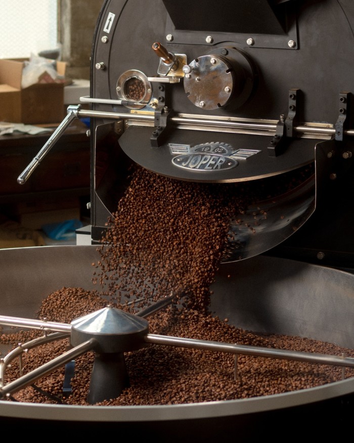 Roasted beans falling from a roaster at Pallet 