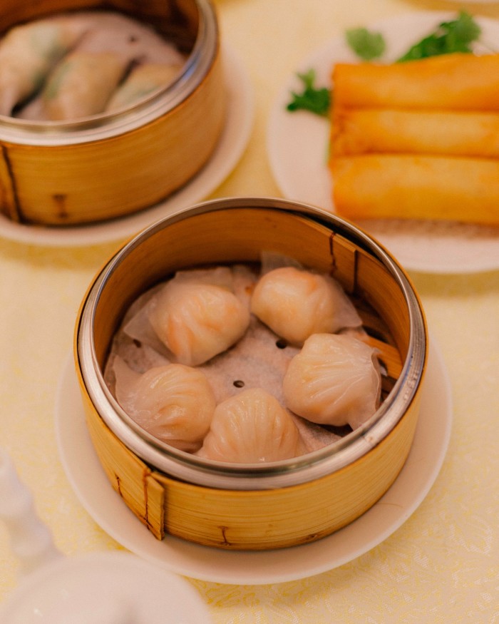 Crab and pork dumplings and spring rolls in circular dishes at Golden Paramount 