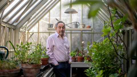 Harry Hyman in his greenhouse