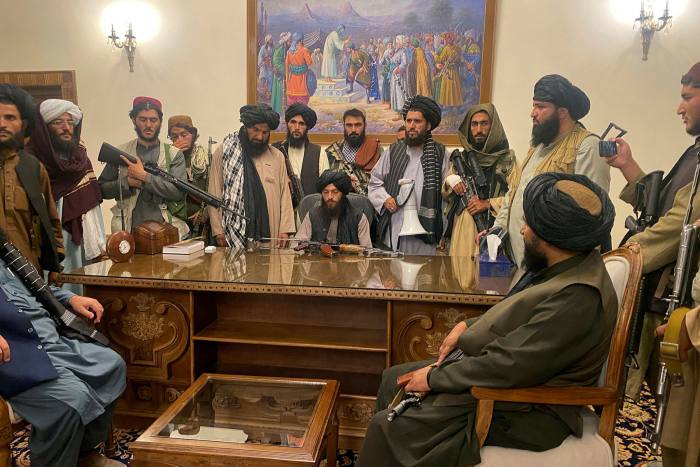 Taliban fighters take control of the Afghan presidential palace on August 15